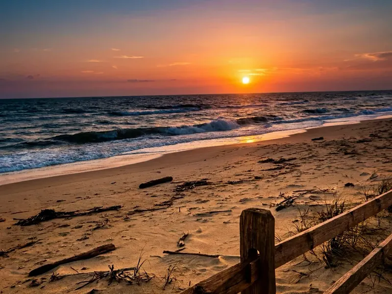 The same beach photo restored with AI, creases and scratches gone